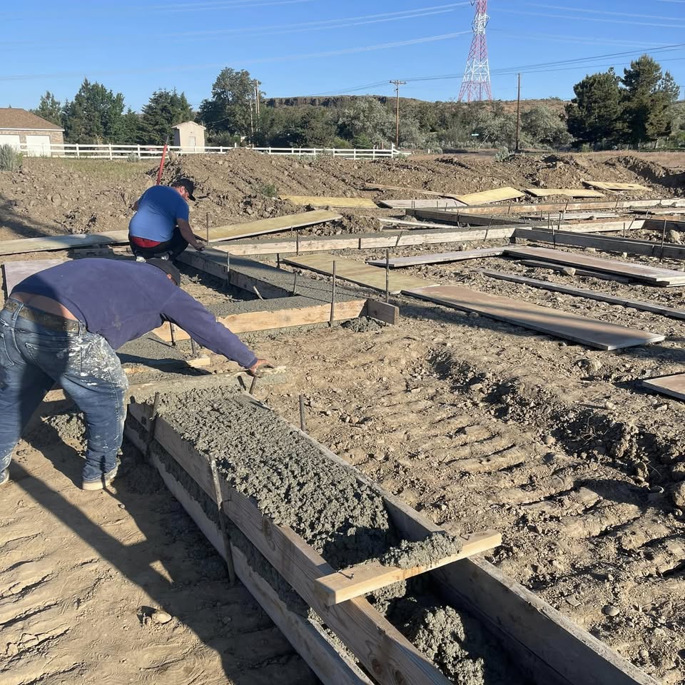 The crew forming and pouring a concrete foundation