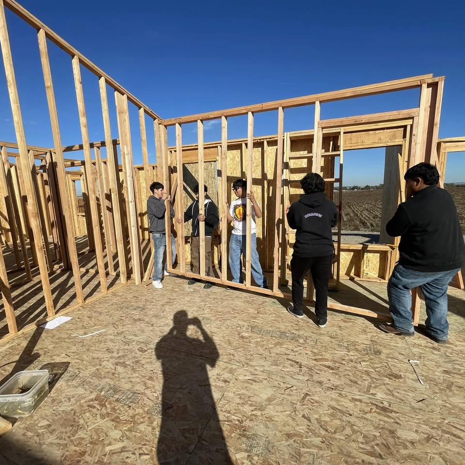 The All Stiles crew framing a wall on a jobsite