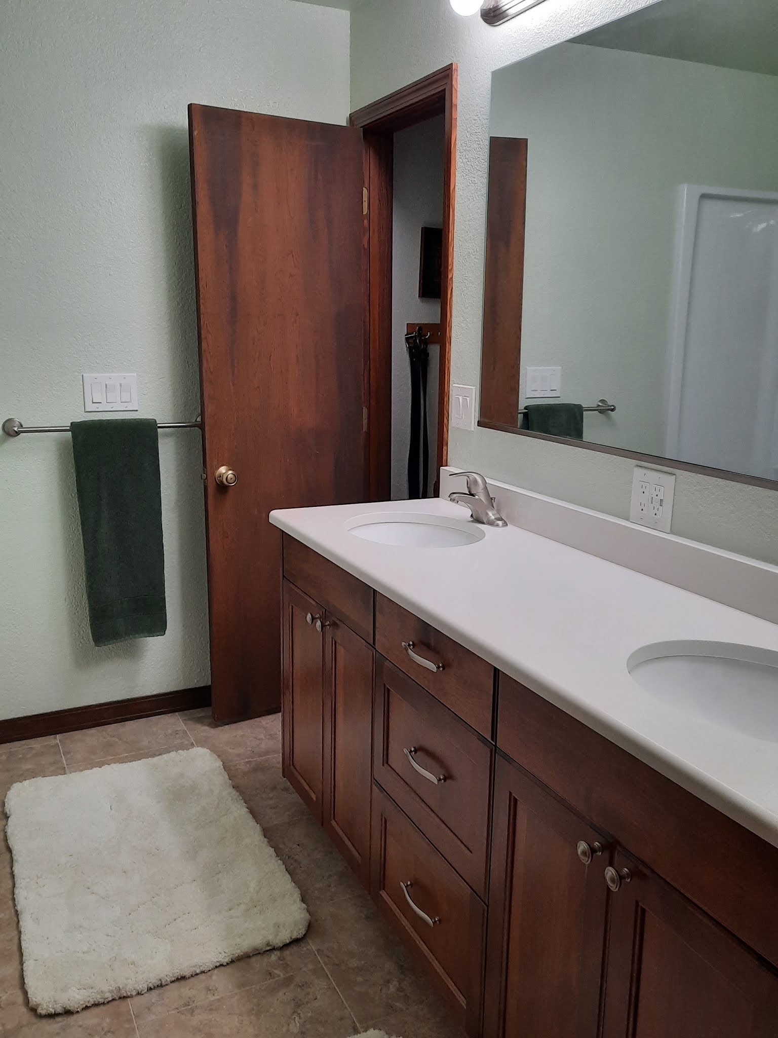 A finished double vanity in a remodeled bathroom